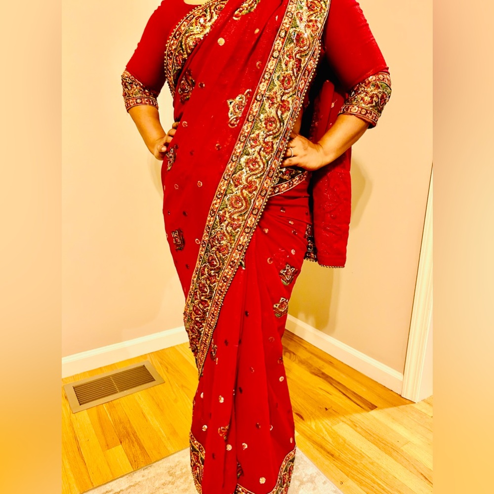 Beautiful saree with intricate bead and stone work. Used with signs of wear